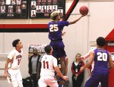 Lemoore's Juelein Arroyo scores two of his 13 points in Friday night's West Yosemite League clash at Hanford.